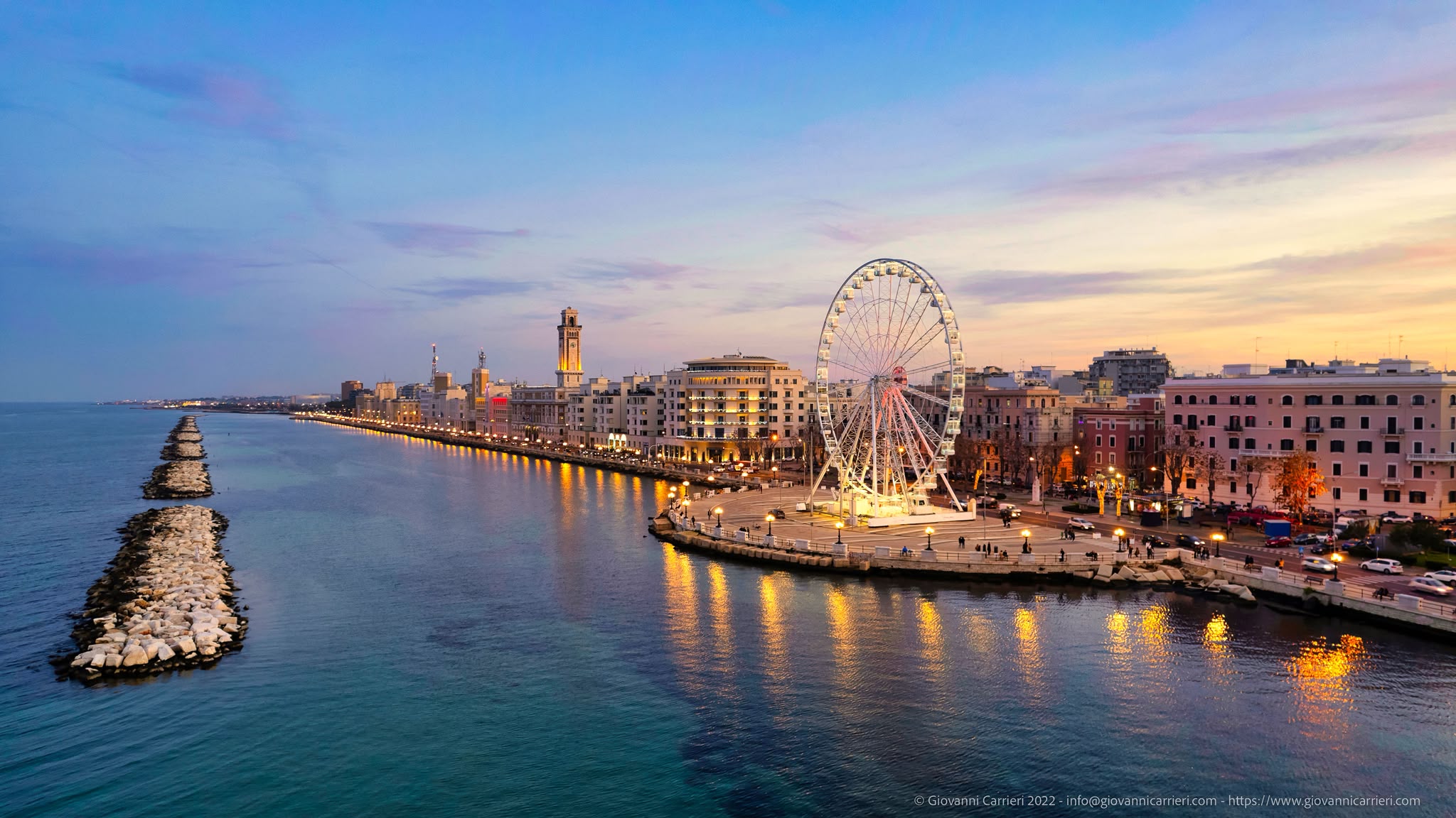 The Bari waterfront at dusk, with the seafront promenade and the big wheel.